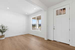 Entry with recessed lighting, baseboards, and hardwood finished floors