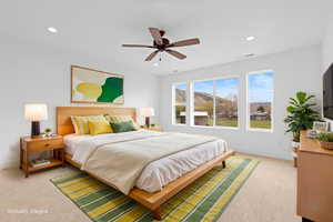 Carpeted bedroom featuring baseboards, recessed lighting, and ceiling fan