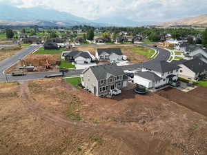 Aerial perspective of suburban area with a mountain backdrop