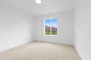 Carpeted bedroom with mountain views