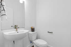 Bathroom with a sink, and toilet