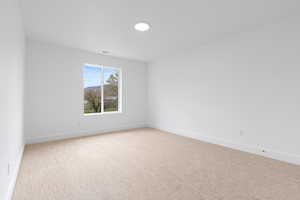 Carpeted bedroom with mountain views