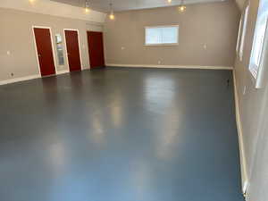 Garage featuring baseboards