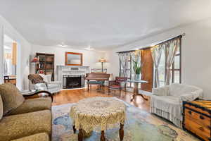 Living room featuring a fireplace and wood finished floors