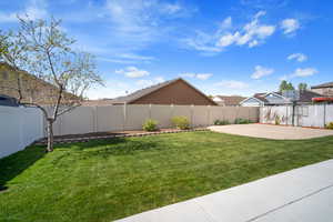 View of yard featuring a patio and a fenced backyard