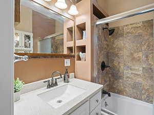 Full bathroom featuring vanity and  shower combination