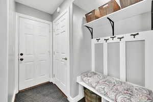Mudroom featuring baseboards