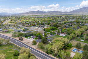 Birds eye view of property featuring a mountain view and a residential view