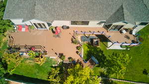 Oversized back deck that stretches the entire length of the back of the house.
