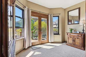 Doors leading out to huge deck. Perfect for looking at the mountain and lake views.