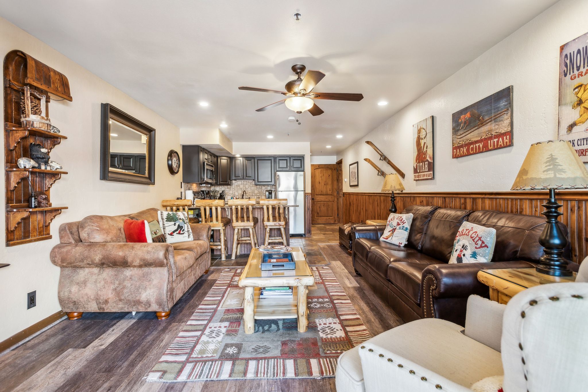 Living room with recessed lighting, ceiling fan, and dark wood-type flooring