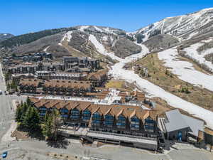 Snowy aerial view featuring a mountain view