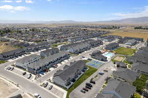 Birds eye view of property with a residential view and a mountain view