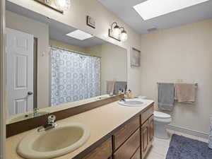 Full bathroom with tile patterned floors, visible vents, and a sink