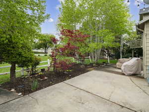View of patio with fence
