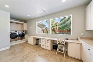Laundry room featuring visible vents, recessed lighting, cabinet space, and washing machine and clothes dryer