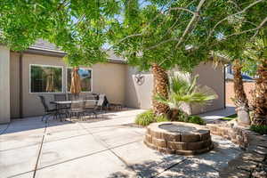 View of patio / terrace featuring outdoor dining area and an outdoor fire pit