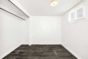 Interior space featuring dark wood-style floors
