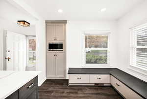 Mudroom with recessed lighting, dark wood-style flooring, and a wealth of natural light