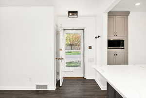 Mudroom with recessed lighting, baseboards, dark wood finished floors, and visible vents