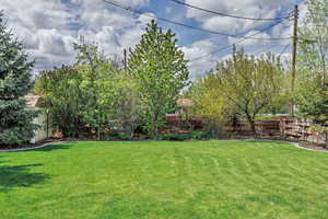 View of yard featuring fence