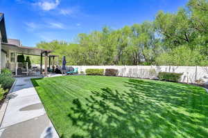 View of yard featuring a fenced backyard and a patio area