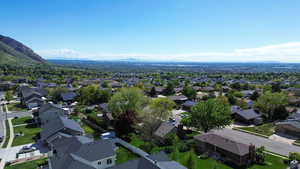 Birds eye view of property with a mountain view and a residential view