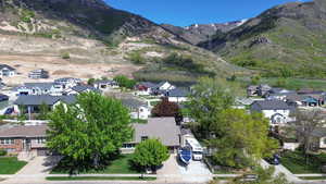 Aerial view featuring a mountain view and a residential view