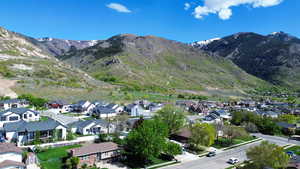 Property view of mountains featuring a residential view