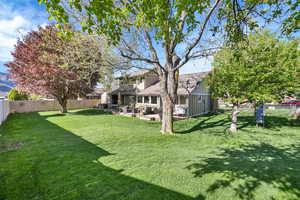 View of yard featuring an outdoor living space, a fenced backyard, and a patio area