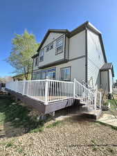 Back of house featuring a deck