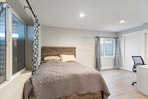 Bedroom with recessed lighting, baseboards, and light wood finished floors
