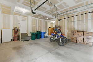 Garage featuring a garage door opener