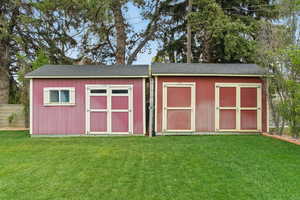 View of shed with fence