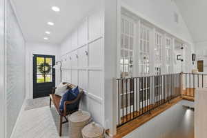 Hall featuring visible vents, recessed lighting, and wood finished floors