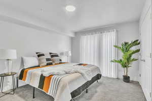 Bedroom featuring baseboards and carpet flooring