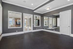 Unfurnished room with recessed lighting, baseboards, ornamental molding, and french doors