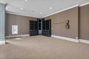 Empty room with recessed lighting, baseboards, and light carpet