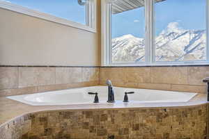 Bathroom with a mountain view and a garden tub