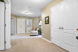 Living area with carpet floors and baseboards
