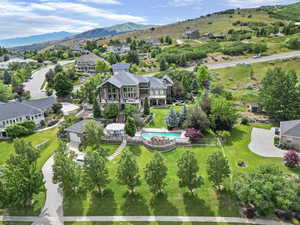 Drone / aerial view with a residential view and a mountain view
