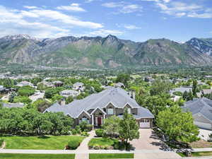 Property view of mountains with a residential view