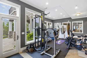 Exercise area featuring recessed lighting, ornamental molding, and visible vents