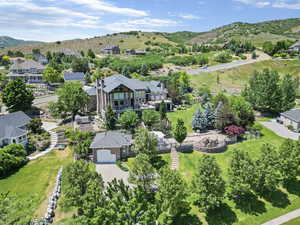 Drone / aerial view featuring a mountain view and a residential view