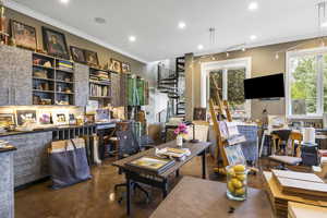 Home office featuring concrete flooring, recessed lighting, and ornamental molding