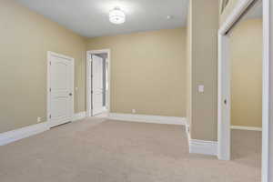 Empty room with baseboards and carpet flooring