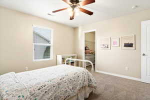 Bedroom with walk-in closet