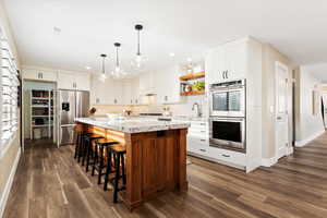 Kitchen with view of hidden pantry