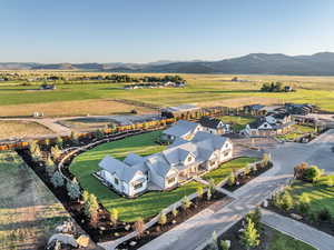 Drone / aerial view with a mountain view and a rural view
