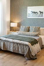 Bedroom with wood finished floors